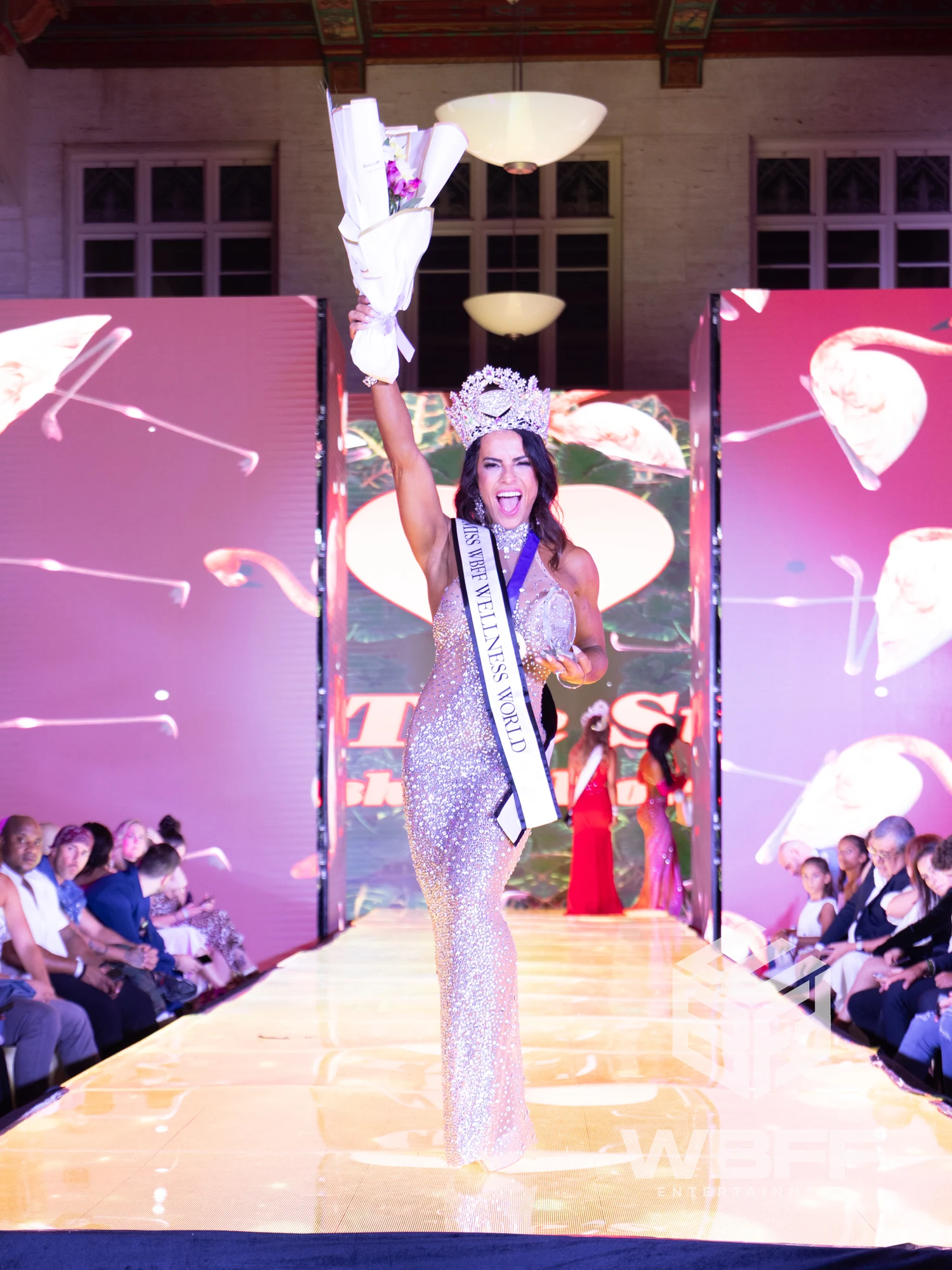 Amanda Ferreira crowned Miss WBFF Wellness World champion on stage